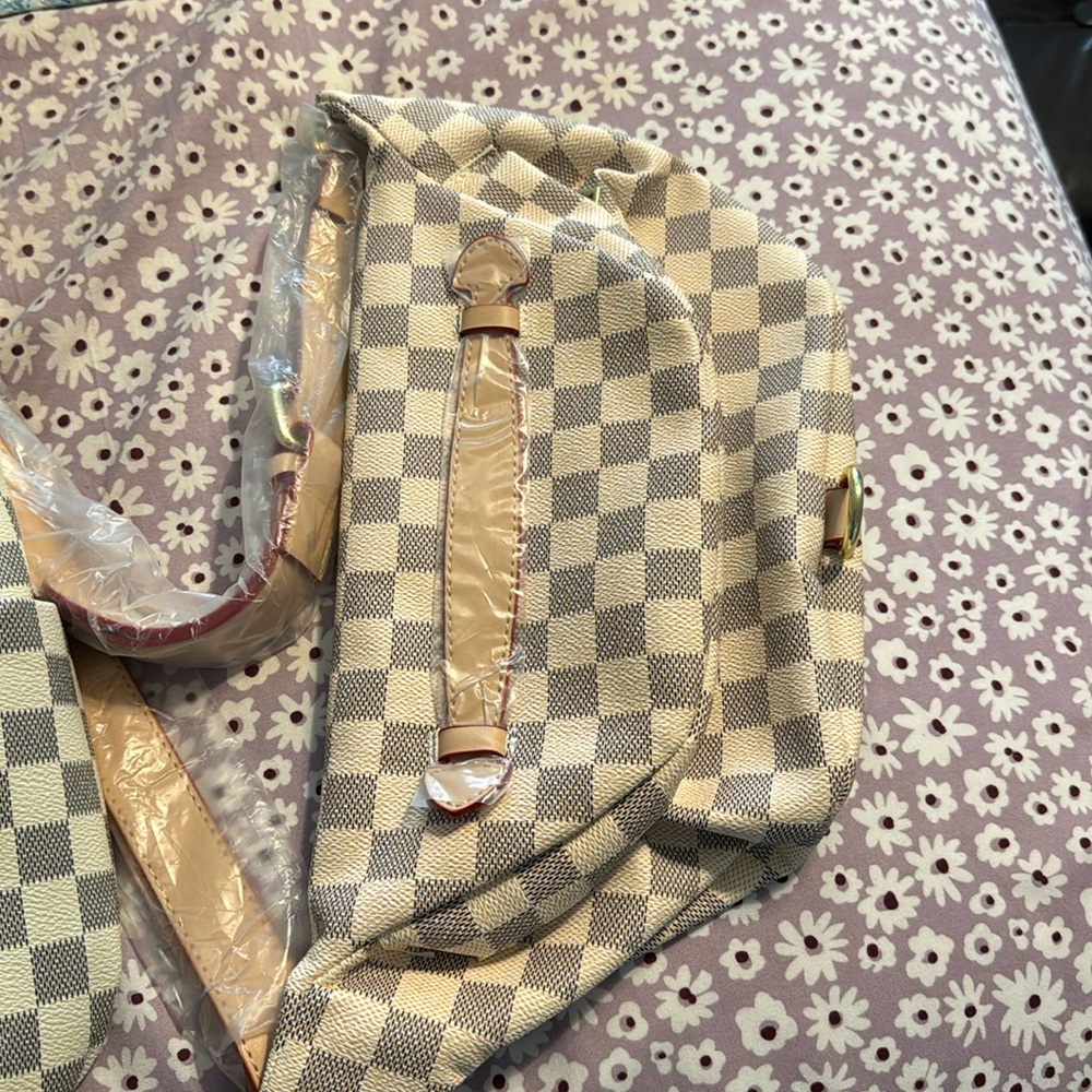 New without tags. checker bag with small bag. Bought from boutique